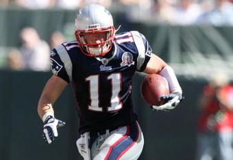 EAST RUTHERFORD, NJ - SEPTEMBER 20:  Julian Edelman #11 of the New England Patriots runs with the ball against the New York Jets at Giants Stadium on September 20, 2009 in East Rutherford, New Jersey.  (Photo by Nick Laham/Getty Images)