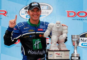 DOVER, DE - SEPTEMBER 26:  Clint Bowyer, driver of the #29 Holiday Inn / Holiday Inn Express Chevrolet, celebrates winning the NASCAR Nationwide Series Dover 200 at Dover International Speedway on September 26, 2009 in Dover, Delaware.  (Photo by Geoff Burke/Getty Images for NASCAR)