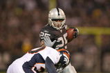 OAKLAND, CA - SEPTEMBER 8:  Running back Justin Fargas #25 of the Oakland Raiders runs with the ball during the NFL game against the Denver Broncos on September 8, 2008 at McAfee Coliseum in Oakland, California. The Broncos defeated the Raiders 41-14. (Photo by Jed Jacobsohn/Getty Images)