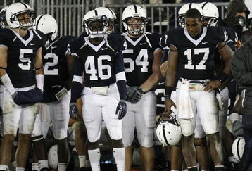 STATE COLLEGE, PA - SEPTEMBER 26:  Daryll Clark of the Penn State Nittnay Lions stands on the sideline with teammates just prior to losing to the Iowa Hawkeyes 21-10 on September 26, 2009 at Beaver Stadium in State College, Pennsylvania.  (Photo by Gregory Shamus/Getty Images)