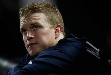 NEW YORK - SEPTEMBER 23:  Nate McLouth #13 of the Atlanta Braves watches from the dugout during the game  against the New York Mets on September 23, 2009 at Citi Field in the Flushing neighborhood of the Queens borough of New York City.  (Photo by Jared Wickerham/Getty Images)