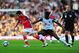 LONDON, ENGLAND - SEPTEMBER 26:  Dickson Etuhu of Fulham chases Cesc Fabregas of Arsenal during the Barclays Premier League match between Fulham and Arsenal at Craven Cottage on September 26, 2009 in London, England.  (Photo by Mike Hewitt/Getty Images)