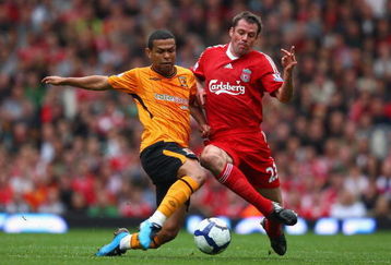 LIVERPOOL, ENGLAND - SEPTEMBER 26:  Jamie Carragher of Liverpool battles for the ball with Geovanni of Hull City during the Barclays Premier League match between Liverpool and Hull City at Anfield on September 26, 2009 in Liverpool, England. (Photo by Clive Brunskill/Getty Images)