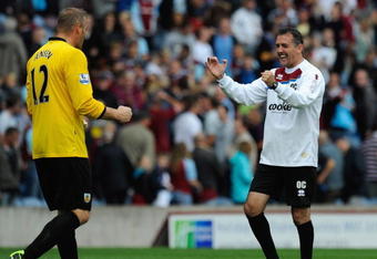 BURNLEY, ENGLAND - AUGUST 23:  Burnley Manager Owen Coyle celebrates with Brian Jensen at the end of the Barclays Premier League match between Burnley and Everton at Turf Moor on August 23, 2009 in Burnley, England.  (Photo by Michael Regan/Getty Images)