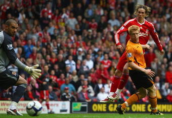 LIVERPOOL, ENGLAND - SEPTEMBER 26:  Fernando Torres of Liverpool scores his team's third goal and his hat trick during the Barclays Premier League match between Liverpool and Hull City at Anfield on September 26, 2009 in Liverpool, England.  (Photo by Clive Brunskill/Getty Images)