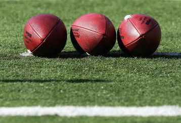 BALTIMORE - NOVEMBER 5:  Three footballs lay on the field prior to the game between the Cincinnati Bengals and the Baltimore Ravens at M&T Bank Stadium on November 5, 2006 in Baltimore, Maryland.  The Ravens defeated the Bengals 26-20. (Photo by Harry How/Getty Images)