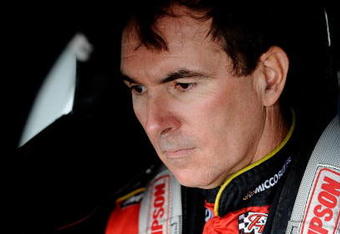 DOVER, DE - SEPTEMBER 26:  Mike Bliss, driver of the 09 Miccosukee Indian Gaming & Resort Dodge waits in the garage during practice for the NASCAR Sprint Cup Series AAA 400 at Dover International Speedway on September 26, 2009 in Dover, Delaware.  (Photo by Jeff Zelevansky/Getty Images for NASCAR)