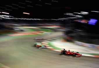 SINGAPORE - SEPTEMBER 27:  Giancarlo Fisichella of Italy and Ferrari drives during the Singapore Formula One Grand Prix at the Marina Bay Street Circuit on September 27, 2009 in Singapore.  (Photo by Clive Mason/Getty Images)