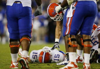 LEXINGTON, KY - SEPTEMBER 26: Quarterback Tim Tebow #15 of the Florida Gators lays on the ground after being sacked by Taylor Wyndham #94 of the Kentucky Wildcats during the third quarter of the game at Commonwealth Stadium on September 26, 2009 in Lexington, Kentucky. (Photo by Andy Lyons/Getty Images)