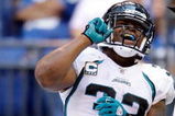 INDIANAPOLIS - SEPTEMBER 13:  Maurice Jones-Drew #32 of the Jacksonville Jaguars celebrates with game offical Greg Wilson after Jones-Drew scored a touchdown during the game against the Indianapolis Colts  at Lucas Oil Stadium on September 13, 2009 in Indianapolis, Indiana.  (Photo by Andy Lyons/Getty Images)