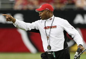 GLENDALE, AZ - SEPTEMBER 13:  Head coach  Mike Singletary of the San Francisco 49ers calls to players during the NFL game against the Arizona Cardinals at the Universtity of Phoenix Stadium on September 13, 2009 in Glendale, Arizona.  The 49ers defeated the Cardinals 20-16.  (Photo by Christian Petersen/Getty Images)