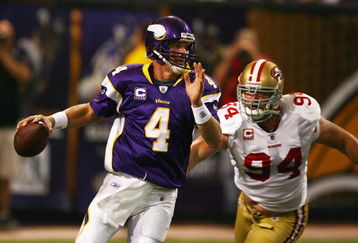 MINNEAPOLIS - SEPTEMBER 27: Brett Favre #4 of the Minnesota Vikings is chased out of the pocket by Pat Williams #94 of the San Francisco 49ers at the Hubert H. Humphrey Metrodome on September 27, 2009 in Minneapolis, Minnesota. (Photo by Jonathan Daniel/Getty Images)