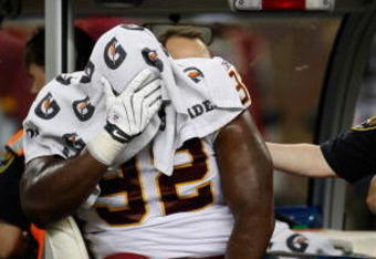 DETROIT, MI - SEPTEMBER 27: Defensive tackle Albert Haynesworth #92 of the Washington Redskins sits on a cart as he is taken off the field after an injury in the first half against the Detroit Lions at Ford Field on September 27, 2009 in Detroit, Michigan. (Photo by Scott Boehm/Getty Images)