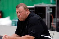 KANSAS CITY, MO - SEPTEMBER 20: Head coach Tom Cable of the Oakland Raiders watches from the bench during warm-ups prior to the start of the game against the Kansas City Chiefs at Arrowhead Stadium on September 20, 2009 in Kansas City, Missouri. (Photo by Jamie Squire/Getty Images)