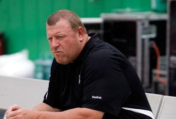 KANSAS CITY, MO - SEPTEMBER 20:  Head coach Tom Cable of the Oakland Raiders watches from the bench during warm-ups prior to the start of the game against the Kansas City Chiefs at Arrowhead Stadium on September 20, 2009 in Kansas City, Missouri.  (Photo by Jamie Squire/Getty Images)