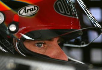 DOVER, DE - SEPTEMBER 26:  Jeff Gordon, driver of the #24 DuPont Chevrolet, sits in his car during practice for the NASCAR Sprint Cup Series AAA 400 at Dover International Speedway on September 26, 2009 in Dover, Delaware.  (Photo by Chris Trotman/Getty Images)