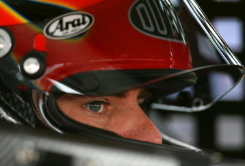 DOVER, DE - SEPTEMBER 26:  Jeff Gordon, driver of the #24 DuPont Chevrolet, sits in his car during practice for the NASCAR Sprint Cup Series AAA 400 at Dover International Speedway on September 26, 2009 in Dover, Delaware.  (Photo by Chris Trotman/Getty Images)
