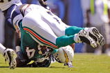 SAN DIEGO - SEPTEMBER 27:  Ronnie Brown #23 of the Miami Dolphins is hit by Kevin Burnett #99 of the San Diego Chargers after a rushing gain during first quarter of the NFL football game as at Qualcomm Stadium on September 27, 2009 in San Diego, California.  (Photo by Kevork Djansezian/Getty Images)