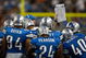 DETROIT, MI - SEPTEMBER 27: A Lions coach holds up a play to show to players during a time out during the game between the Washington Redskins against the Detroit Lions at Ford Field on September 27, 2009 in Detroit, Michigan. The Lions defeated the Redskins 19-14. (Photo by Scott Boehm/Getty Images)