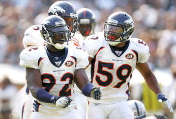 OAKLAND, CA - SEPTEMBER 27:   Wesley Woodyard #59 congratulates Elvis Dumervil #92 of the Denver Broncos after Dumervil sacked JaMarcus Russell of the Oakland Raiders at the Oakland-Alameda County Coliseum on September 27, 2009 in Oakland, California.  (Photo by Ezra Shaw/Getty Images)