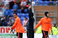 WIGAN, ENGLAND - SEPTEMBER 26:  Petr Cech (R) of Chelsea is sent off and changes with Henrique Hilario during the Barclays Premier League match between Wigan Athletic and Chelseaat DW Stadium on September 26, 2009 in Wigan, England.  (Photo by Phil Cole/Getty Images)