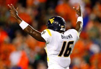 AUBURN, AL - SEPTEMBER 19:  Quarterback Jarrett Brown #16 of the West Virginia Mountaineers celebrates after a touchdown against the Auburn Tigers at Jordan-Hare Stadium on September 19, 2009 in Auburn, Alabama.  (Photo by Kevin C. Cox/Getty Images)