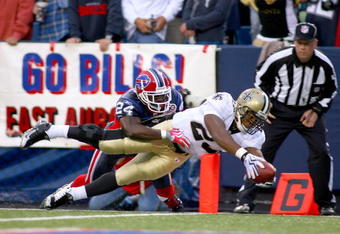 ORCHARD PARK, NY - SEPTEMBER 27: Pierre Thomas #23  of the New Orleans Saints dives for the pylon to score a touchdown as Terrence McGee #24 defends for the Buffalo Bills at Ralph Wilson Stadium on September 27, 2009 in Orchard Park, New York.  (Photo by Rick Stewart/Getty Images)