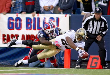ORCHARD PARK, NY - SEPTEMBER 27: Pierre Thomas #23  of the New Orleans Saints dives for the pylon to score a touchdown as Terrence McGee #24 defends for the Buffalo Bills at Ralph Wilson Stadium on September 27, 2009 in Orchard Park, New York.  (Photo by Rick Stewart/Getty Images)