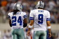 ARLINGTON, TX - SEPTEMBER 20: Quarterback Tony Romo #9 and Marion Barber #24 of the Dallas Cowboys at Cowboys Stadium on September 20, 2009 in Arlington, Texas. (Photo by Ronald Martinez/Getty Images)