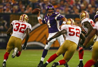 MINNEAPOLIS - SEPTEMBER 27: Brett Favre #4 of the Minnesota Vikings throws a pass while being rushed by (L-R) Michael Lewis #32, Patrick Willis #52 and Parys Haralson #98 of the San Francisco 49ers at the Hubert H. Humphrey Metrodome on September 27, 2009 in Minneapolis, Minnesota. The Vikings defeated the 49ers 27-24. (Photo by Jonathan Daniel/Getty Images)