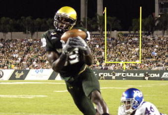 TAMPA, FL - SEPTEMBER 12: Wide receiver Taurus Johnson #89 of the University of South Florida Bulls grabs a pass in the end zone for a touchdown against the Kansas University Jayhawks at Raymond James Stadium on September 12, 2008 in Tampa, Florida.  (Photo by Al Messerschmidt/Getty Images)