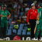 CENTURION, SOUTH AFRICA - SEPTEMBER 27:  Andrew Strauss of England and Albie Morkel (L) look on as Graham Smith discusses the use of a runner with umpire Steve Davis, during The ICC Champions Trophy match between South Africa and England played at Supersport Park on September 27, 2009 in Centurion, South Africa.  (Photo by Julian Herbert/Getty Images)