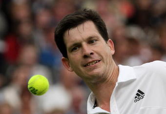 LONDON, ENGLAND - MAY 17:  Tim Henman watches the ball during the Mens Singles match against Andre Agassi  during the 'Centre Court Celebration' at Wimbledon on May 17, 2009 in London, England.  (Photo by Hamish Blair/Getty Images)