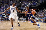 MEMPHIS, TN - MARCH 14:  Ben Uzoh #1 of the Tulsa Golden Hurricane drives around Antonio Anderson #5 of the Memphis Tigers during the Championship of the Conference USA Basketball Tournament at FedExForum on March 14, 2009 in Memphis, Tennessee.  Memphis beat Tulsa 64-39. (Photo by Joe Murphy/Getty Images)