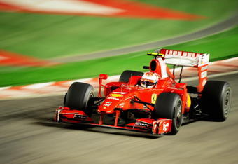 SINGAPORE - SEPTEMBER 27:  Kimi Raikkonen of Finland and Ferrari drives during the Singapore Formula One Grand Prix at the Marina Bay Street Circuit on September 27, 2009 in Singapore.  (Photo by Clive Mason/Getty Images)