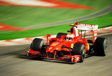 SINGAPORE - SEPTEMBER 27:  Kimi Raikkonen of Finland and Ferrari drives during the Singapore Formula One Grand Prix at the Marina Bay Street Circuit on September 27, 2009 in Singapore.  (Photo by Clive Mason/Getty Images)