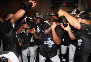 NEW YORK - SEPTEMBER 27:  The New York Yankees celebrate after defeating the Boston Red Sox on September 27, 2009 at Yankee Stadium in the Bronx borough of New York City. The Yankees won the game 4-2 to earn their 100th win of the season as well as clinching the American League Eastern Division.  (Photo by Jim McIsaac/Getty Images)