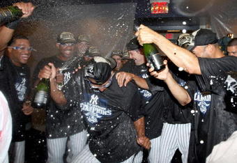 NEW YORK - SEPTEMBER 27:  The New York Yankees celebrate after defeating the Boston Red Sox on September 27, 2009 at Yankee Stadium in the Bronx borough of New York City. The Yankees won the game 4-2 to earn their 100th win of the season as well as clinching the American League Eastern Division.  (Photo by Jim McIsaac/Getty Images)