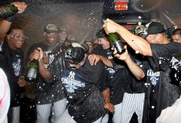NEW YORK - SEPTEMBER 27:  The New York Yankees celebrate after defeating the Boston Red Sox on September 27, 2009 at Yankee Stadium in the Bronx borough of New York City. The Yankees won the game 4-2 to earn their 100th win of the season as well as clinching the American League Eastern Division.  (Photo by Jim McIsaac/Getty Images)