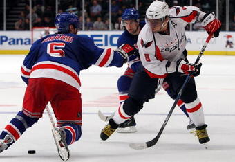NEW YORK - SEPTEMBER 24:  Alex Ovechkin #8 of the Washington Capitals skates against Dan Girardi #5 of the New York Rangers during their preseason game on  September 24, 2009 at Madison Square Garden in New York City.  (Photo by Jim McIsaac/Getty Images)