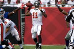 TAMPA, FL - SEPTEMBER 27:  Quarterback Josh Johnson #11 of the Tampa Bay Buccaneers looks for an open receiver against the New York Giants during the game at Raymond James Stadium on September 27, 2009 in Tampa, Florida.  (Photo by J. Meric/Getty Images)