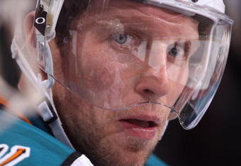 GLENDALE, AZ - SEPTEMBER 26:  Dany Heatley #15 of the San Jose Sharks watches from the bench during the preseason NHL game against the Phoenix Coyotes at Jobing.com Arena on September 26, 2009 in Glendale, Arizona.  The Coyotes defeated the Sharks 2-0.  (Photo by Christian Petersen/Getty Images)