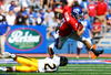 LAWRENCE, KS - SEPTEMBER 26:  Quarterback Todd Reesing #5 of the Kansas Jayhawks evades C.J. Bailey #20 of the Southern Mississippi Golden Eagles during the game on September 26, 2009 at Memorial Stadium in Lawrence, Kansas.  (Photo by Jamie Squire/Getty Images)