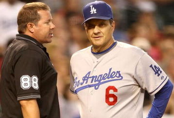 PHOENIX - SEPTEMBER 07:  Manager Joe Torre of the Los Angeles Dodgers argues with home plate umpire Doug Eddings after Manny Ramirez was ejected during the major league baseball game against the Arizona Diamondbacks at Chase Field on September 7, 2009 in Phoenix, Arizona.  (Photo by Christian Petersen/Getty Images)