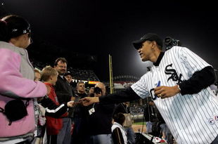 CHICAGO - OCTOBER 12:  U.S. Senator for Illinois, Barack Obama, signs autographs prior to the start of Game Two of the American League Championship Series between the Chicago White Sox and the Los Angeles Angels of Anaheimon October 12, 2005 at U.S. Cellular Field in Chicago, Illinois. Obama will throw out the ceremonial first pitch.  The Angels lead the series 1-0.  (Photo by Stephen Dunn/Getty Images)
