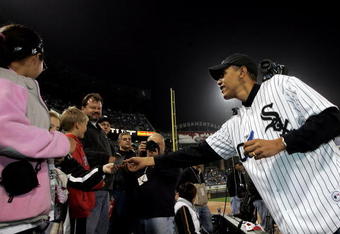 CHICAGO - OCTOBER 12:  U.S. Senator for Illinois, Barack Obama, signs autographs prior to the start of Game Two of the American League Championship Series between the Chicago White Sox and the Los Angeles Angels of Anaheimon October 12, 2005 at U.S. Cellular Field in Chicago, Illinois. Obama will throw out the ceremonial first pitch.  The Angels lead the series 1-0.  (Photo by Stephen Dunn/Getty Images)