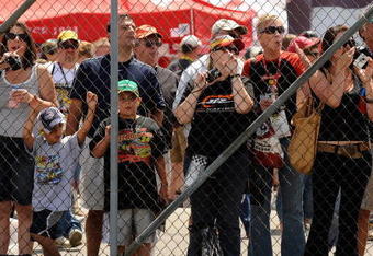 WATKINS GLEN, NY - AUGUST 07:  Fans stand in the garage area waiting for drivers to pass during practice for the NASCAR Sprint Cup Series Heluva Good! Sour Cream Dips at Watkins Glen International on August 7, 2009 in Watkins Glen, New York.  (Photo by Rusty Jarrett/Getty Images for NASCAR)