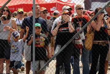 WATKINS GLEN, NY - AUGUST 07:  Fans stand in the garage area waiting for drivers to pass during practice for the NASCAR Sprint Cup Series Heluva Good! Sour Cream Dips at Watkins Glen International on August 7, 2009 in Watkins Glen, New York.  (Photo by Rusty Jarrett/Getty Images for NASCAR)
