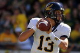 EUGENE, OR - SEPTEMBER 26: Kevin Riley #13 of the California Bears looks for an open receiver downfield in the third quarter of the game against the Oregon Ducks at Autzen Stadium on September 26, 2009 in Eugene, Oregon. (Photo by Steve Dykes/Getty Images)