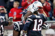 FOXBORO, MA - SEPTEMBER 27:  Tom Brady #12 of the New England Patriots celebrates the touchdown with Chris Baker #86 after Brady threw a pass to Baker for the touchdown in the fourth quarter the Atlanta Falcons on September 27, 2009 at Gillette Stadium in Foxboro, Massachusetts. The Patriots defeated the Falcons 26-10.  (Photo by Elsa/Getty Images)